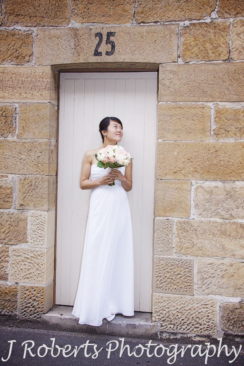 Bride in doorway of sandstone building the rocks sydney - wedding photography sydney